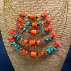 Genuine red coral, turquoise dyed howlite and coral crystals on gold cord